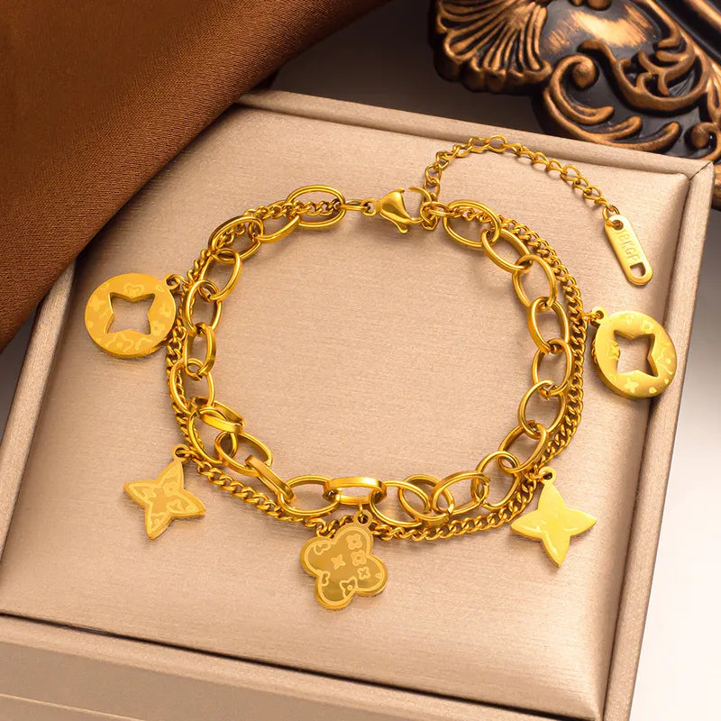 Gold Charm Brac.