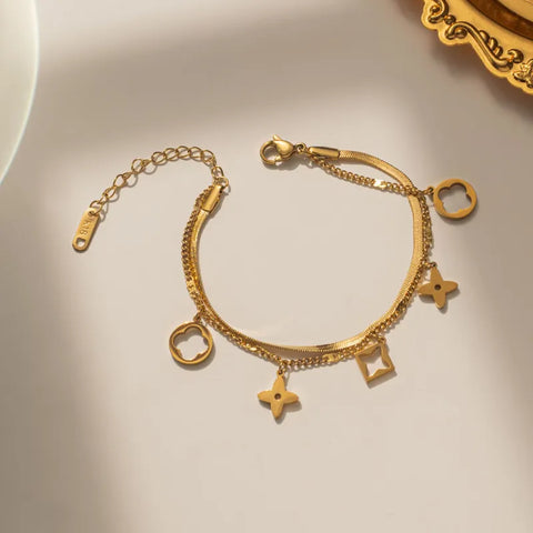 Gold Charm Brac.